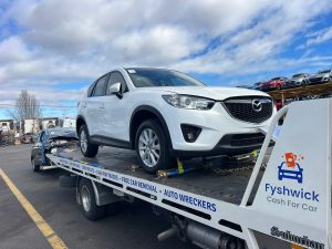 car being towed to our Canberra car yard